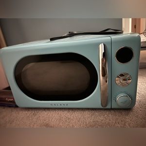 Brand new retro looking microwave. This still has plastic on it